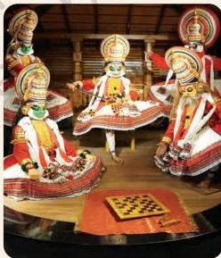 Kathakali dancers in elaborate costumes and make-up enact the dice-game scene from the Mahabharata, a story told entirely through body and gesture