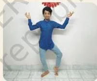 A student striking a sculptural dance pose with stylised hand gestures, imitating the Dancing Shiva of Badami