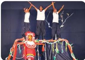 School children performing a creative play on stage, showing symbolism at work in a live performance