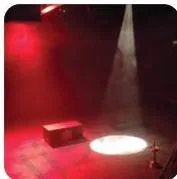 A red PAR wash on the stage combined with a white pool of light from a profile spotlight placed on the floor