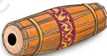 A mridangam, a barrel-shaped two-sided drum photographed among the four instruments in the chapter's opening exercise