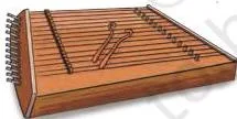 A santoor, a wide flat wooden box strung with many strings, shown among the chapter's four opening instrument photographs