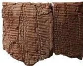 Ancient Babylonian clay tablet inscribed with rows of numerals, the first known list of perfect squares and perfect cubes
