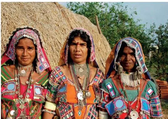 Women wearing colourful traditional apparel with embroidery, the craft that designers now adapt for high-fashion jackets and dresses