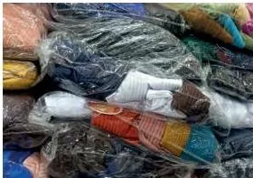 A finished apparel packed neatly in a transparent cover, showing protection and professional presentation