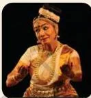 A Mohiniyattam dancer with eyes closed and face fully expressive, the emotion radiating through the expression alone
