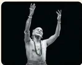 Odissi dancer Kelucharan Mohapatra with a serene smiling expression, depicting the emotion of joy