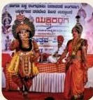 A Yakshagana performer in ornate costume and make-up, showing how appearance carries the character in this form