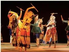 A performer in a Garbha turn, showing how the twisting hip movement leads the rotation in the dance's style of turning