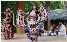 A Kalbelia dancer in traditional dress swaying the hips from side to side, the movement typical of Rajasthani folk dance