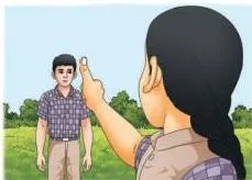 A child holding up a thumb at arm's length so it covers the head of a friend standing five metres away, demonstrating apparent size