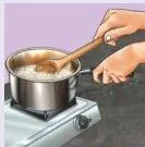 Rice being cooked on a gas stove
