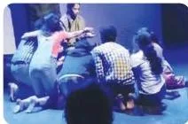A group of actors on stage together, each supporting the scene through listening, timing and coordinated movement in an ensemble