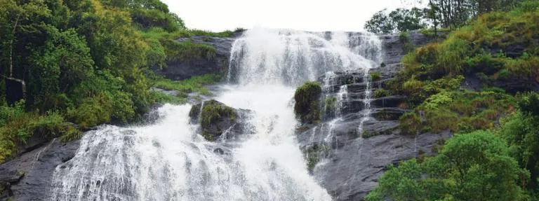 Waterfall at Periyakanal near Munnar, Kerala, falling over the uneven rocky surface of a plateau