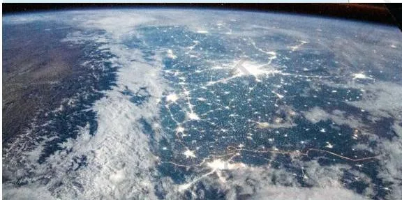 Satellite image of the Gangetic plains at night, with dense concentrations of lights showing where population is heavy