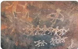 Prehistoric Bhimbetka painting of dancers with interlinked arms beside a figure holding an object that looks like a musical instrument