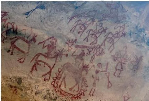 Prehistoric rock paintings of animals in red and white earth pigment on a Bhimbetka rock shelter wall, a key site in the history of arts class 9 chapter