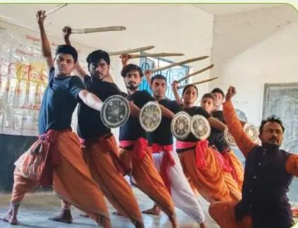 Students practising one or two martial-arts movements, the small-group task Activity 13.1 sets with a visiting practitioner or a teacher's QR-code guidance
