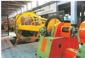 Photograph of cable manufacturing machines and coiled cables at the HCL facility in Rupnarainpur, West Bengal, showing that the electronics industry includes hardware production