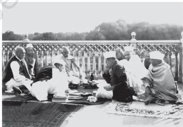 Congress leaders seated together at a meeting in Allahabad in 1931, led by Mahatma Gandhi among senior party colleagues
