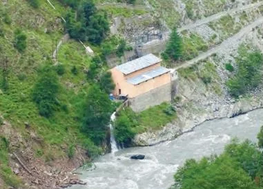 A small hydroelectric plant harnessing a mountain stream in Himachal Pradesh, converting flowing water into electricity