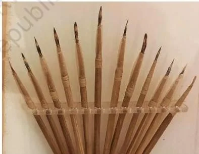 Art materials and tools stored neatly in an organised way so they can be found and used easily by others