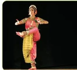 Kuchipudi dancer in stitched silk with the gochi kattu drape, caught in a quick-footed sculpturesque pose