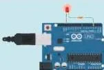 An Arduino board with its onboard LED glowing, the second state of the Blink programme