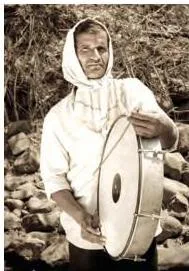 A town crier beating a drum to announce an important message to villagers, representing the dhindora tradition of public announcement