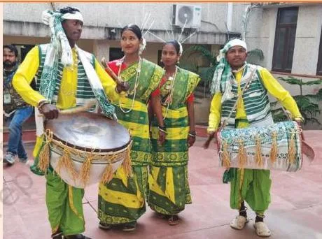 Musicians of Jharkhand playing the large Nagada drum during a regional folk song, showing how songs use local instruments and movements