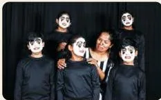 Young mime artists performing with expressive gestures and no speech, demonstrating silent storytelling