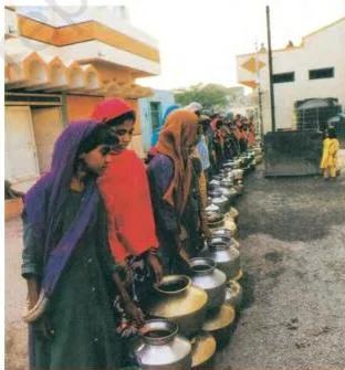 A woman carrying earthen water pots across a dry landscape, the desert image the chapter links to common ideas about water shortage