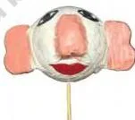 Making ball puppets with nose and eyes made of paper stuck on it and then painted. A broomstick is inserted in the ball for movement.