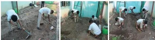 Students digging and levelling soil with shovels to prepare a raised bed