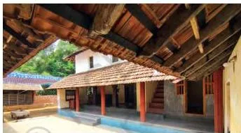 A traditional south Indian house with wood used for building roofs, doors, windows and pillars