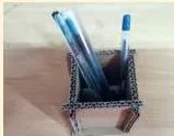 A three-part drawing of the prototype steps — sketching with dimensions, marking and cutting the material, and assembling with glue